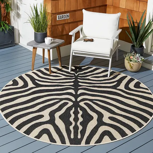 white and black custom outdoor rug in backyard