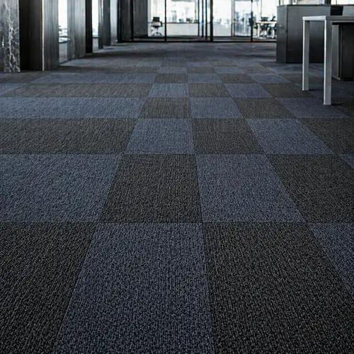 Charcoal and slate modular carpet tiles in grid pattern for Dubai office floors