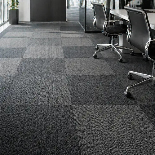 Modular two-tone carpet tiles in modern Dubai open-plan office fit-out