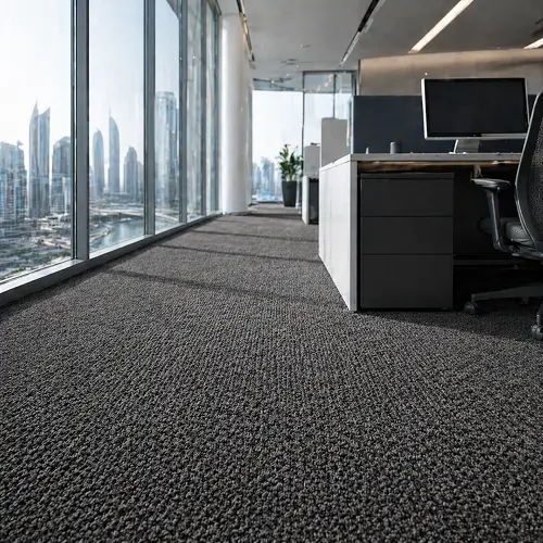 Charcoal grey loop-pile office carpet installation in Dubai Business Bay commercial space